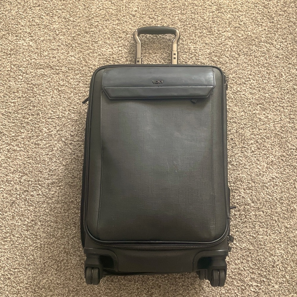 Gray Tumi suitcase